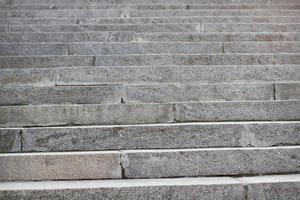 Abstract stairs in black and white, abstract steps, stairs in the city. Granite stairs,wIde stone stairway often seen on monuments and landmarks. Selective focus. photo