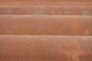 Abstract image of metal pipes showing light on the other end. Background texture. photo