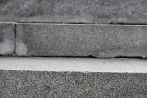 Abstract stairs in black and white, abstract steps, stairs in the city. Granite stairs,wIde stone stairway often seen on monuments and landmarks. Selective focus. photo