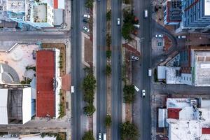 Busy street with small buildings near the beach area of Cancun photo