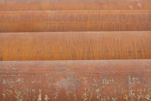 Abstract image of metal pipes showing light on the other end. Background texture. photo