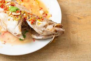 Steamed grouper fish with lime and chillies photo