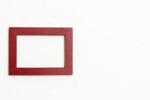 empty picture frame on white wall background photo