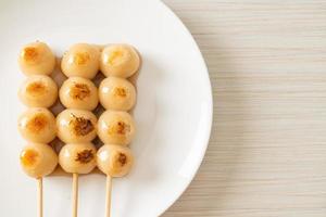 Mitarashi dango. Dumpling in a sweet soy sauce photo