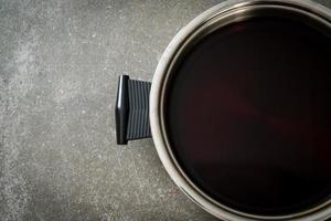 black soup in hot pot for shabu or sukiyaki photo