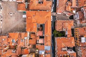 Beautiful orange roofs of Venice in Italy. Aerial view.