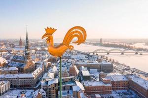 Aerial panorama view of Riga old town during beautiful winter day in Latvia. Freezing temperature in Latvia. White Riga. photo