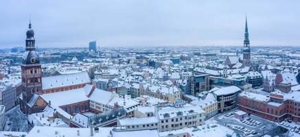 Panoramic aerial view of winter Riga old town covered in snow. Domes cathedral view from above. photo