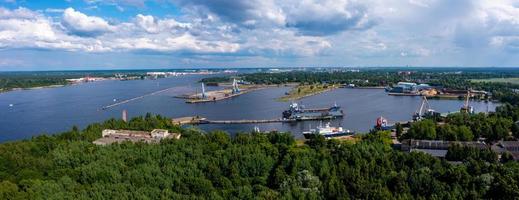 Riga, Latvia. June 10, 2021. Cargo ship at floating dry dock is being renovated photo