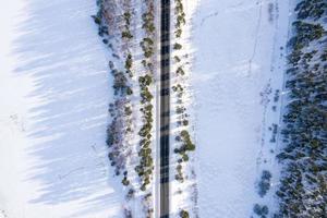 Road in the winter Alps. Winter landscape. Aerial view