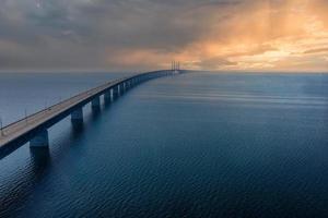 Panoramic aerial view of the Oresundsbron bridge between Denmark and Sweden. Oresund Bridge view at sunset photo