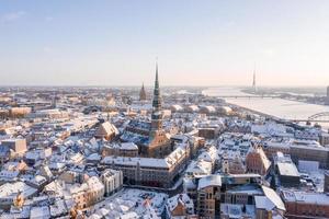 Aerial panorama view of Riga old town during beautiful winter day in Latvia. Freezing temperature in Latvia. White Riga. photo