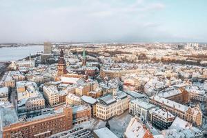 Aerial panorama view of Riga old town during beautiful winter day in Latvia. Freezing temperature in Latvia. White Riga. photo