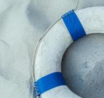 The Life preserver put on the beach. photo