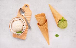 Coconut ice cream flavours in half of coconut setup on white stone background. Summer and Sweet menu concept. photo