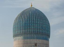 The top of the dome with tiles and mosaics. the details of the architecture of medieval Central Asia