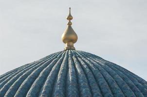 The roof of the dome with a lance in ancient Asian style. the details of the architecture of medieval Central Asia photo