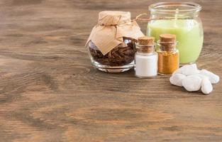 set ingredients and spice for aromatherapy and body care on wooden surface. SPA still life photo