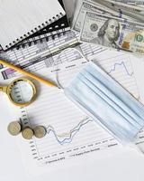 arrangement finances elements graph with medical mask photo