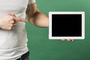 close up man s finger pointing finger toward digital tablet with black screen display photo