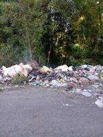 a public road that has been turned into a garbage dump by irresponsible people photo