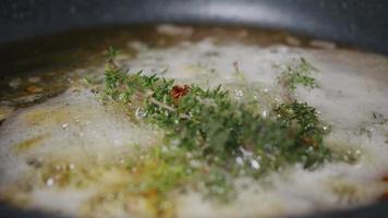 Frying Herbs Thyme with Butter for Meat video