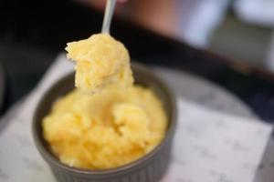 Spoon of plain mashed potato.