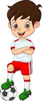 Little boy dressed in a soccer uniform with soccer ball vector