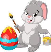 Cartoon easter bunny painting an egg vector