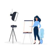 The girl is giving a presentation in front of the camera. The teacher conducts a lesson online. The concept of blogs, online training and conferences. Camera on a tripod, softbox. vector