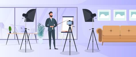 A man in a business suit with a tie is giving a presentation to the camera. The teacher is writing a lesson. The concept of blogging, online training and conferences. Camera on a tripod, softbox. vector