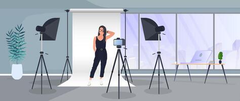 Photo Studio . Girl posing to the camera. White canvas background on tripods. Camera on a tripod, softbox. Professional photo studio. vector