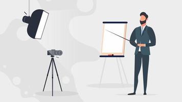 A man in a business suit with a tie is giving a presentation to the camera. The teacher is writing a lesson. The concept of blogging, online training and conferences. Camera on a tripod, softbox. vector