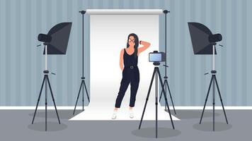 Photo Studio . Girl posing to the camera. White canvas background on tripods. Camera on a tripod, softbox. Professional photo studio. vector