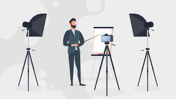 A man in a business suit with a tie is giving a presentation to the camera. The teacher is writing a lesson. The concept of blogging, online training and conferences. Camera on a tripod, softbox. vector