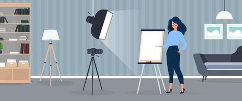 The girl is giving a presentation in front of the camera. The teacher conducts a lesson online. The concept of blogs, online training and conferences. Camera on a tripod, softbox. vector