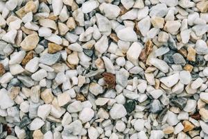 Texture of decorative stones or gravel as a background image. Top view. Copy, empty space for text photo