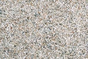 Texture of decorative stones or gravel as a background image. Top view. Copy, empty space for text photo