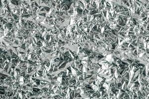 Surface texture of crumpled aluminum silver foil photo