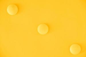 Yellow balls on yellow background. Minimal concept. Top view. Copy, empty space for text photo