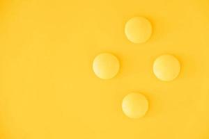 Yellow balls on yellow background. Minimal concept. Top view. Copy, empty space for text photo