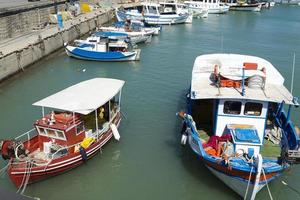 Small fishing boat on the dock. photo