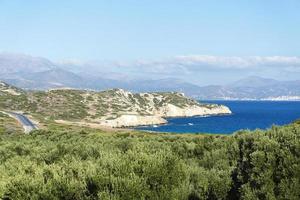 Landscape, sea, trees and mountains. photo