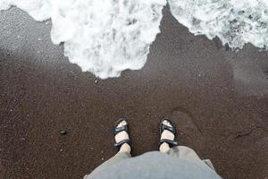 Beach with red sand. The island of Santorini. photo