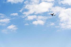 Airplane high speed on the clouds sky. photo