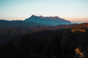 evening mountain view sunset and purple twilight photo