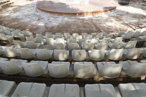 Plastic chairs for stadium, theater in the open air. photo