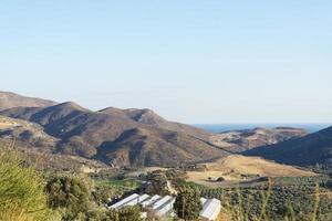 Hills with bushes on a Sunny day. photo