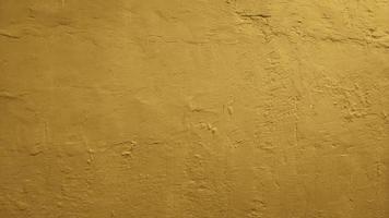 yellow gold abstract cement concrete wall texture background photo