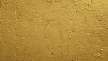 fondo de textura de pared de hormigón de cemento abstracto de oro amarillo foto